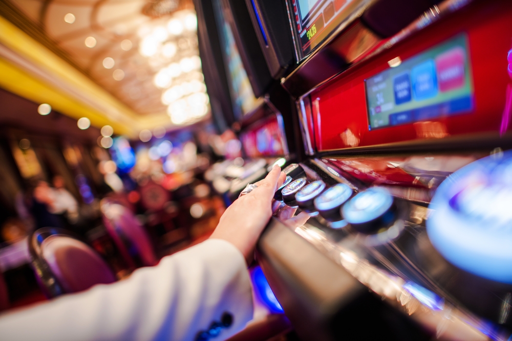 A lady playing casino slots